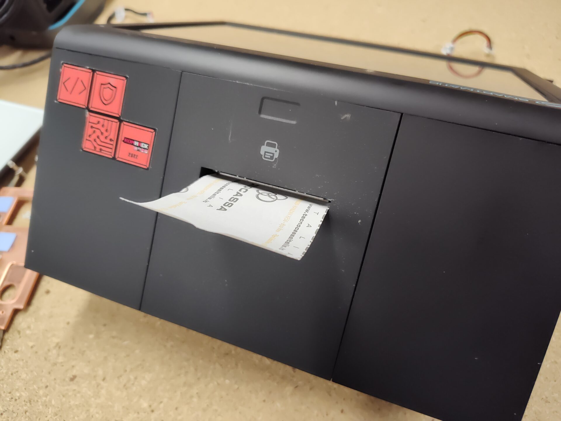 The rear printer accepts a roll of thermal paper